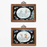 A pair of porcelain wall plaques Chinese porcelain, Famille noir with images of the immortals. 19th/