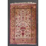 An Oriental hand-made carpet made of silk, Kachan. (210 x 135).