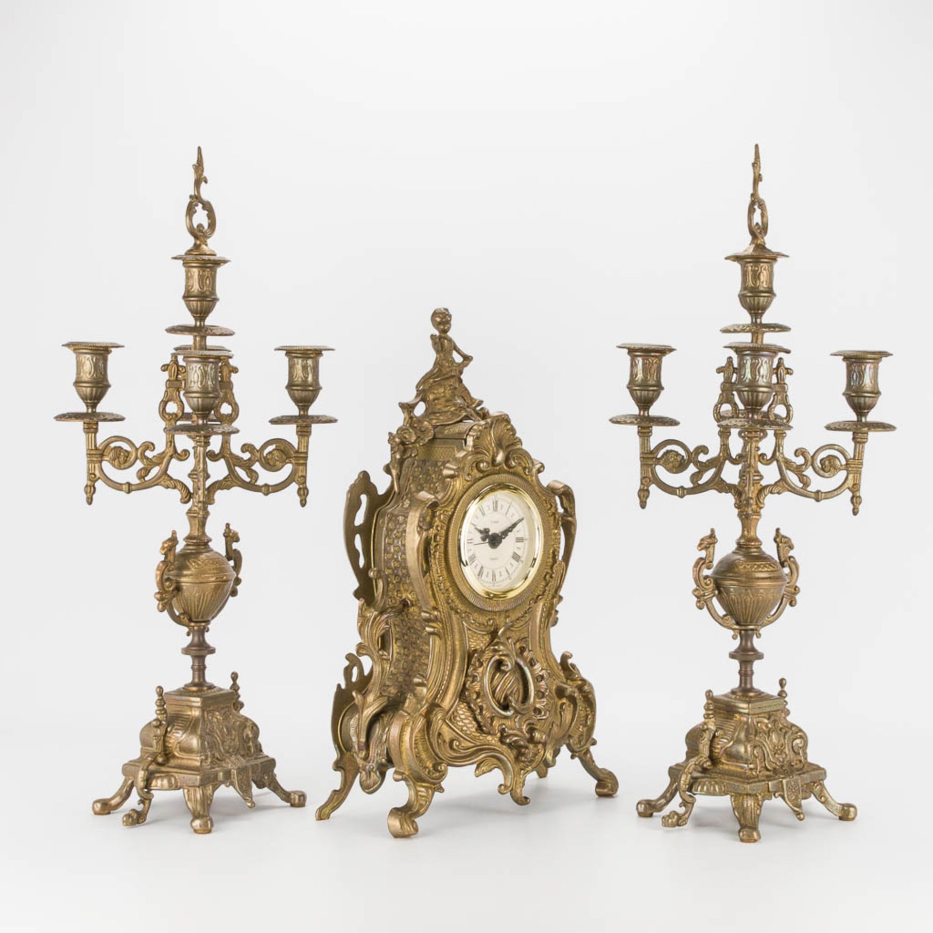 A bronze 3-piece garniture with clock and candelabra. The second half of the 20th century. (22 x 22 - Image 9 of 16