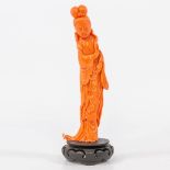 A Chinese red coral sculptured statue of a lady, around 1980. (7 x 14 x 19 cm)
