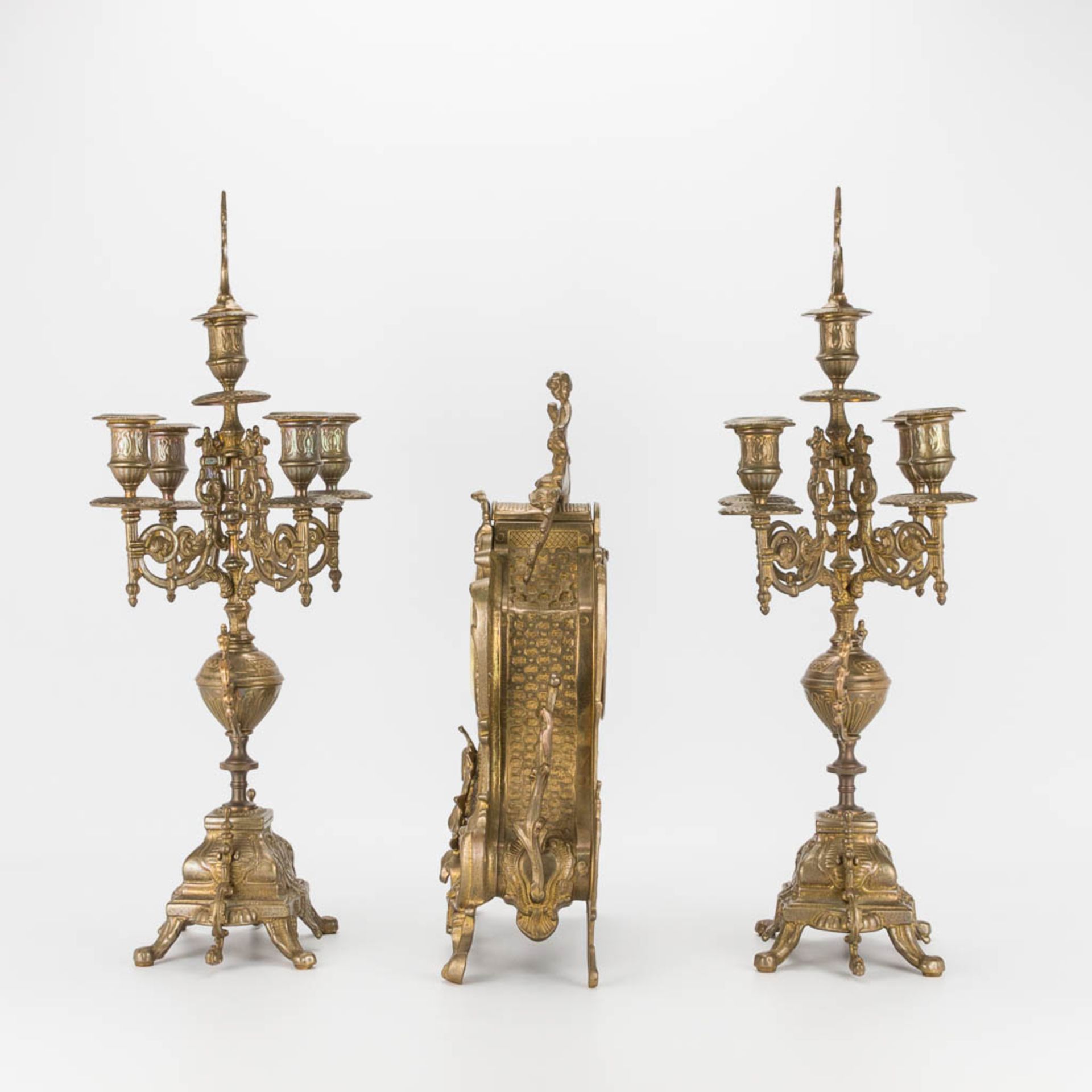 A bronze 3-piece garniture with clock and candelabra. The second half of the 20th century. (22 x 22 - Image 2 of 16