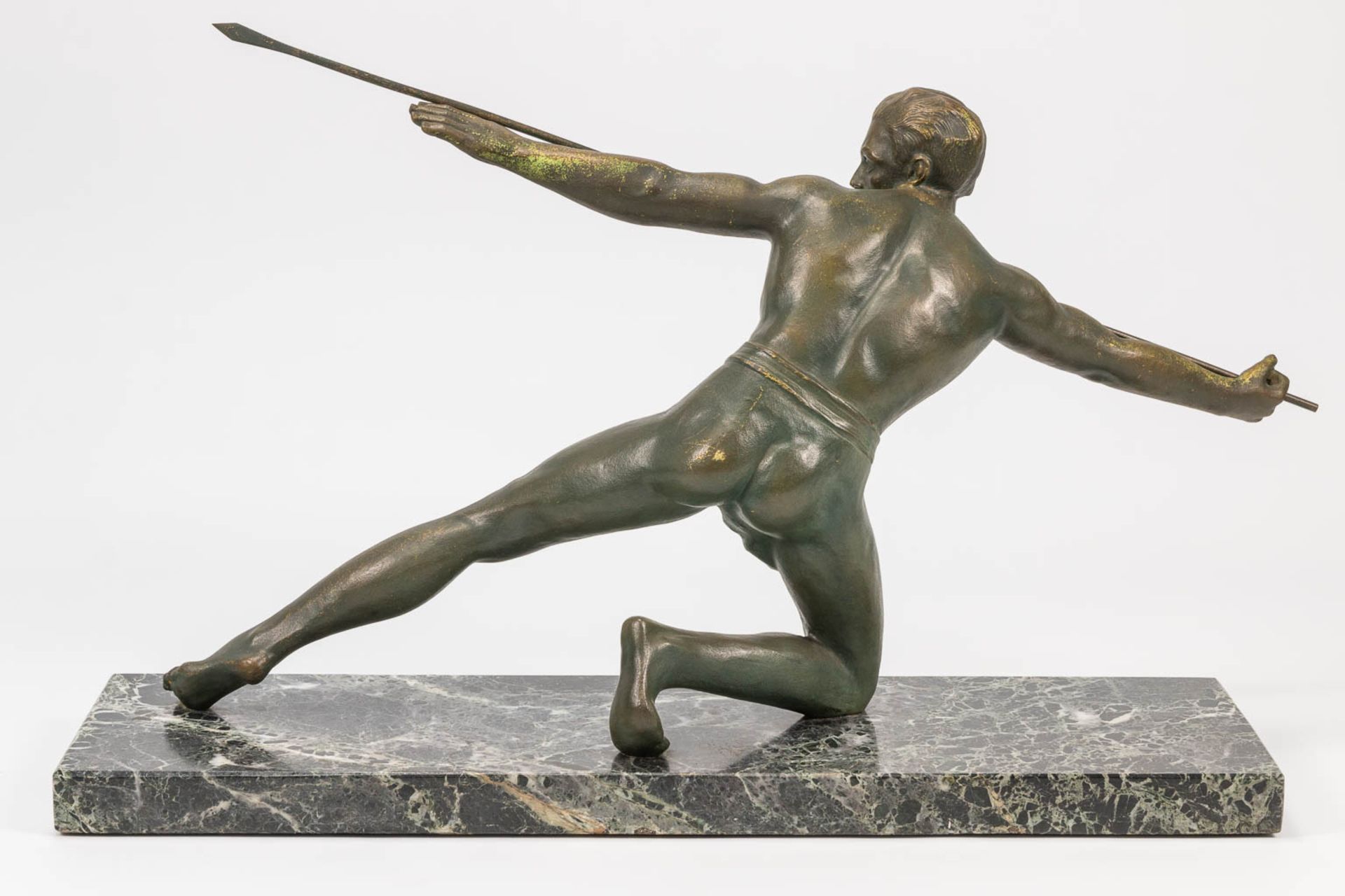 A bronze statue of a spear thrower in art deco style and standing on a marble base. The first half o - Bild 10 aus 13