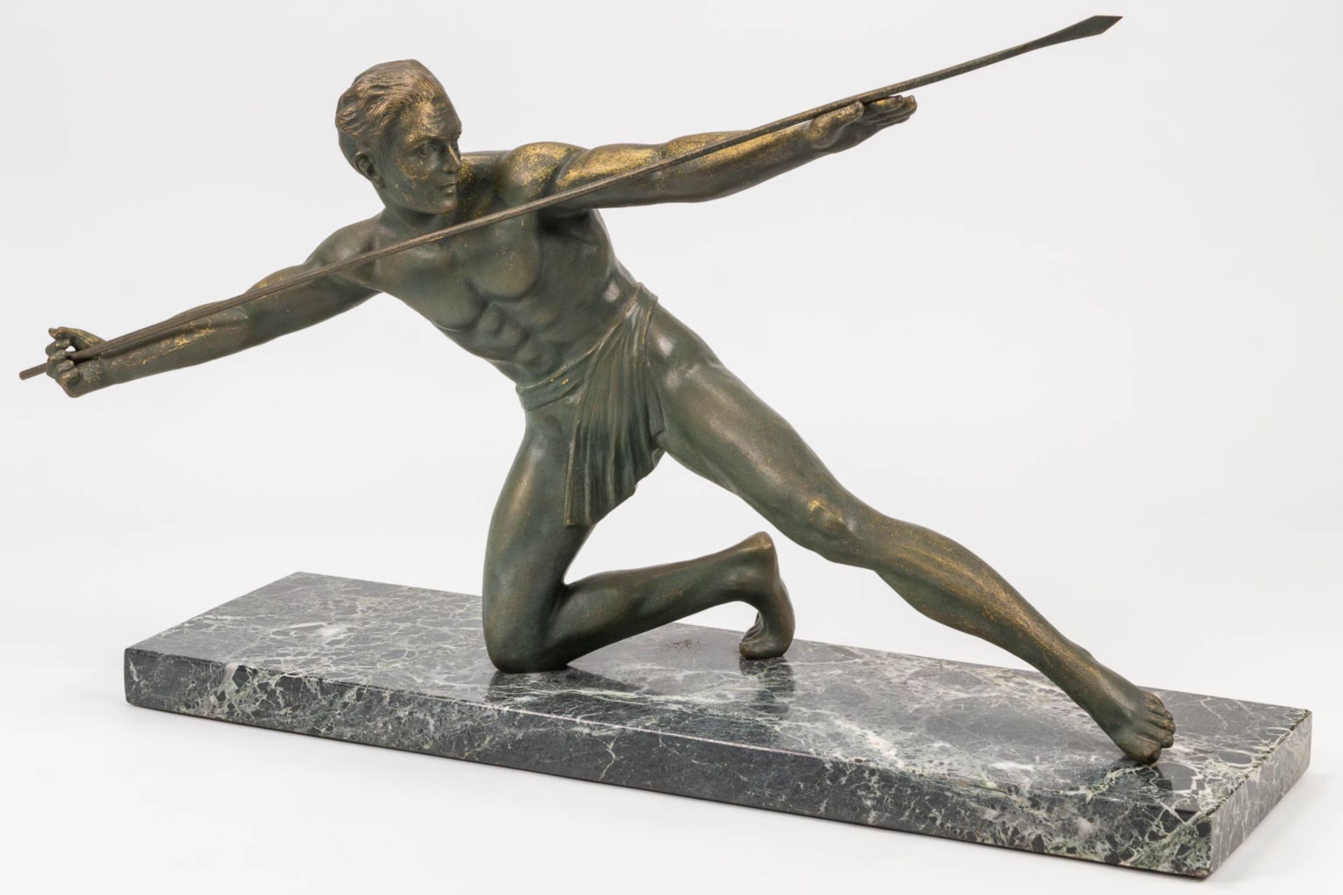 A bronze statue of a spear thrower in art deco style and standing on a marble base. The first half o - Bild 9 aus 13