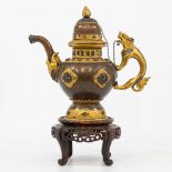 An exceptional Tibetan/Nepalese ceremonial ewer made of copper with gilt decorations