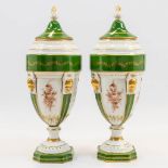 A pair of porcelain urns with lid, handpainted flower decor with green and gold tones. Made in Limog