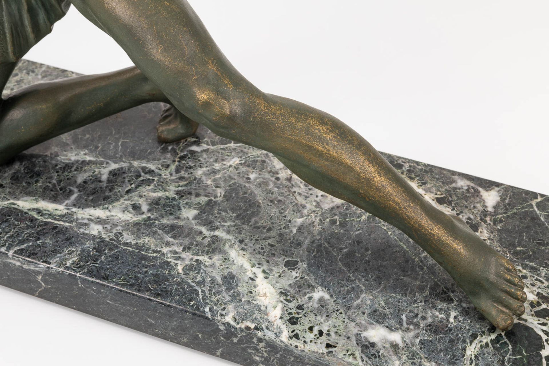 A bronze statue of a spear thrower in art deco style and standing on a marble base. The first half o - Bild 12 aus 13