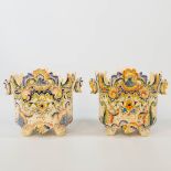 A pair of cache-pots with hand-painted decor, made of faience in Rouen, France. (23 x 27 x 22 cm)