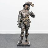 A large bronze statue of a Musketeer with sword, on a marble base. (25 x 25 x 87 cm)