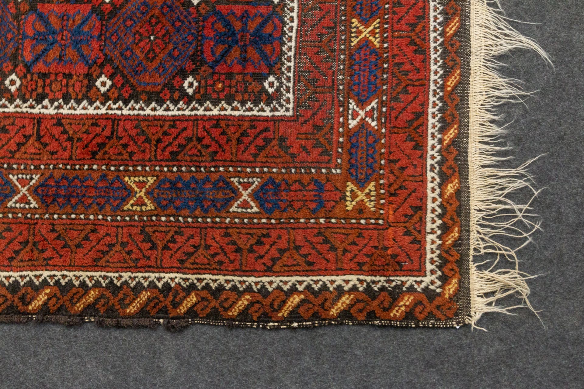 An Eastern hand-made carpet. (114 x 195 cm). - Image 2 of 6