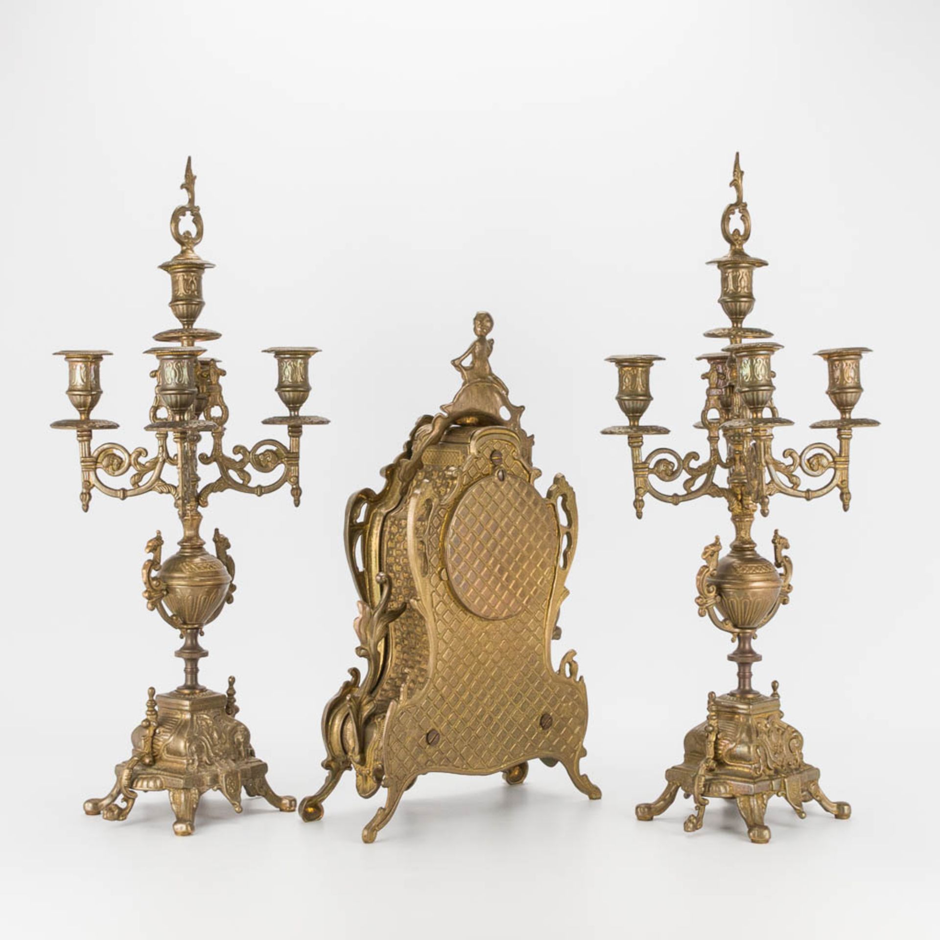 A bronze 3-piece garniture with clock and candelabra. The second half of the 20th century. (22 x 22 - Image 6 of 16