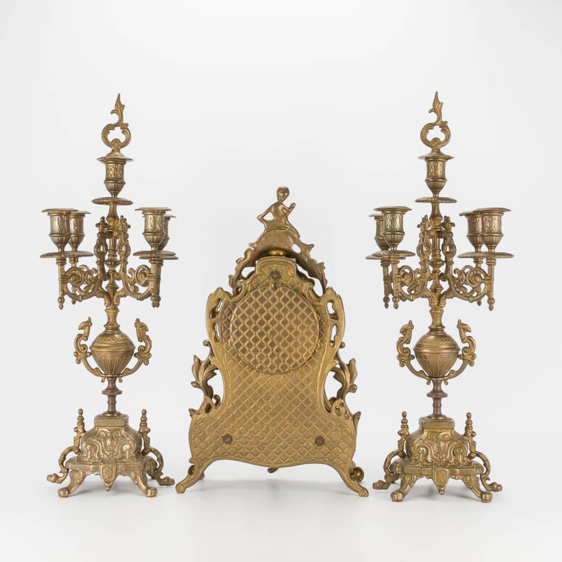 A bronze 3-piece garniture with clock and candelabra. The second half of the 20th century. (22 x 22 - Image 8 of 16