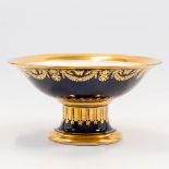 A tazza made in Limoges with cobalt blue and gold hand-painted decor. (11 x 21 cm)