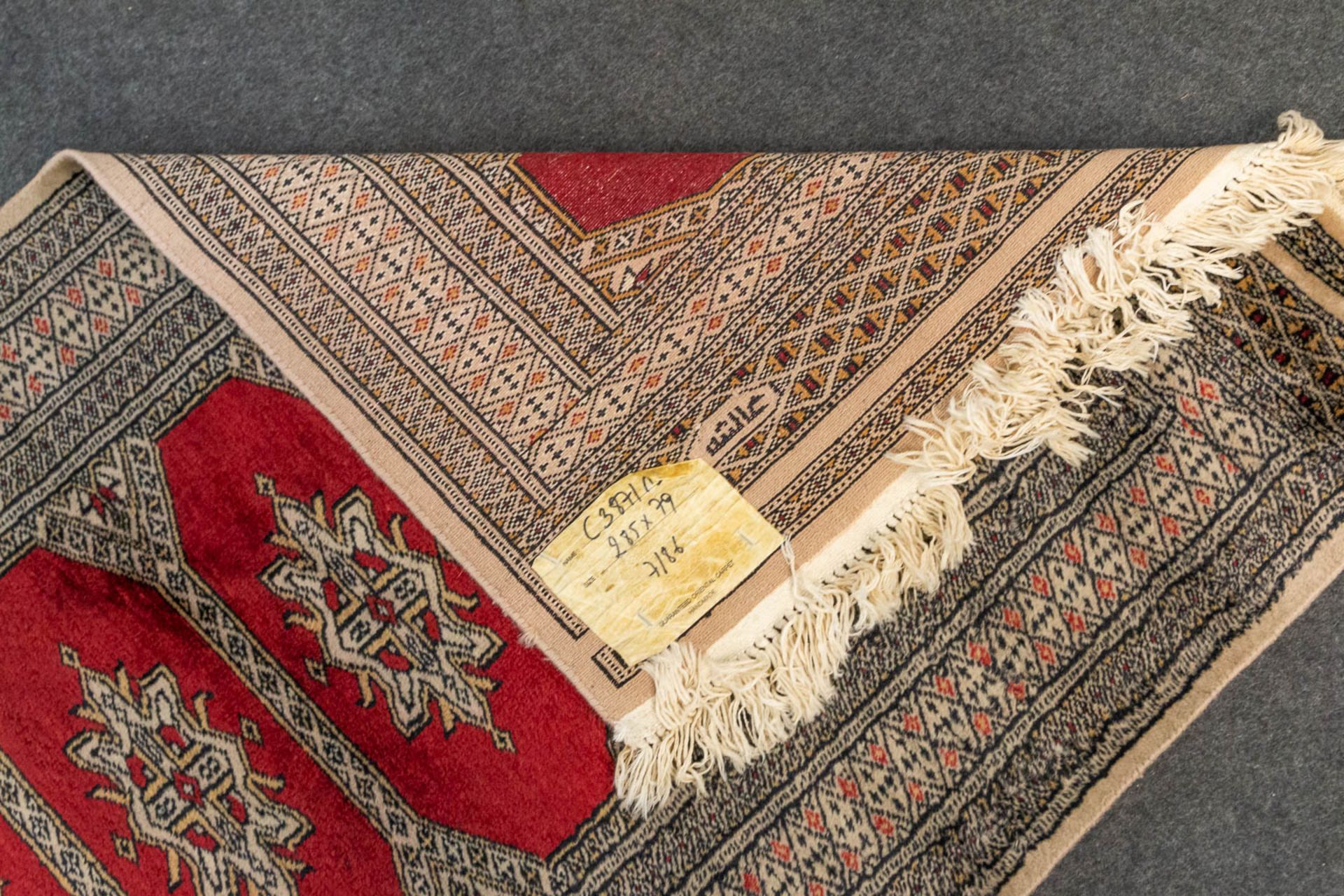 An Oriental hand-made runner carpet Bokhara (285 x 79 cm). - Image 4 of 7