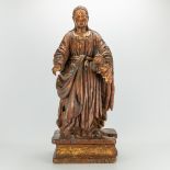 An antique wood sculptured statue of a holy figurine with lamb. Remains of original polychromy. 17th