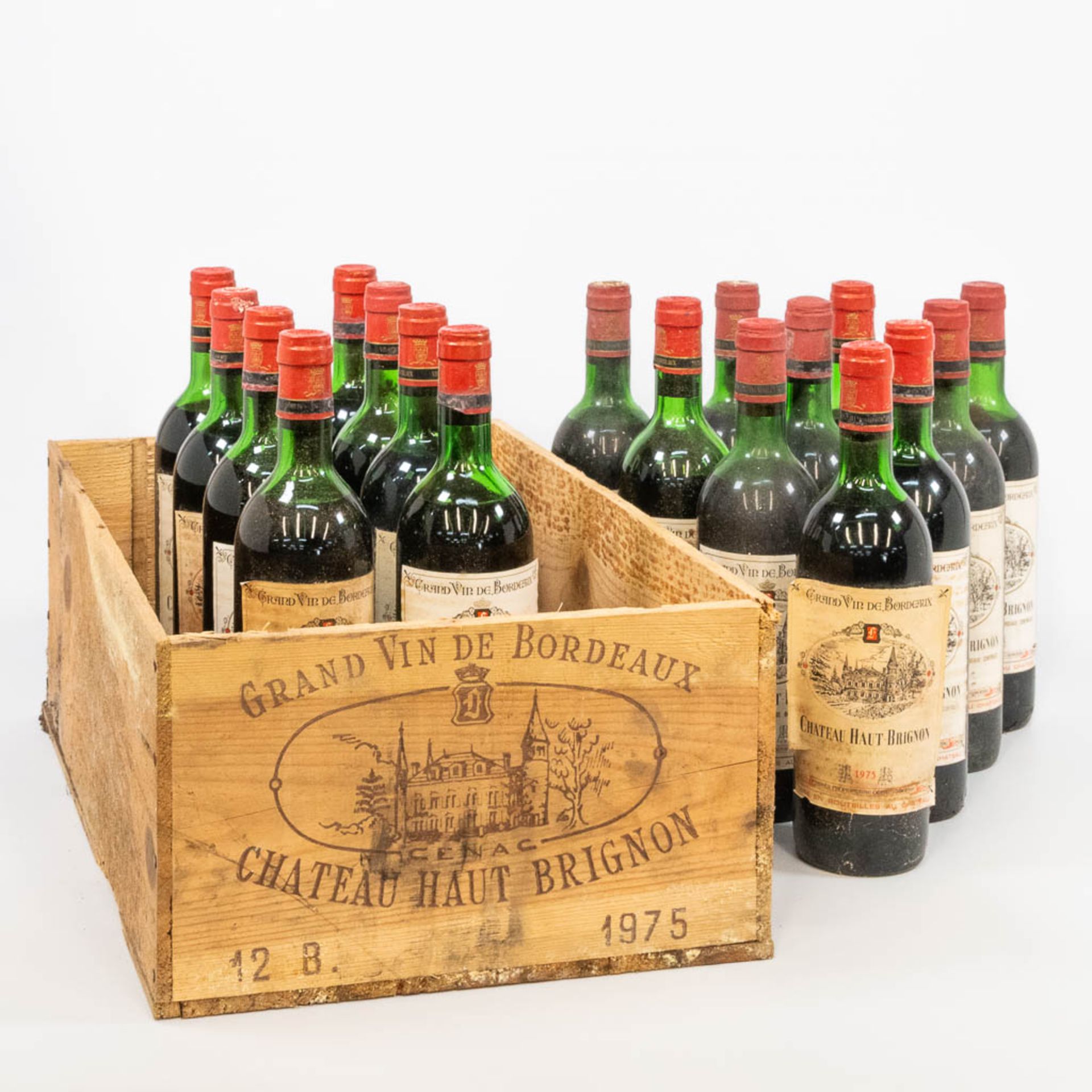 A collection of 18 bottles of Chateau Haut Brignon 1975 with original wood crate. .