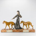An art deco group of a lady walking her two greyhounds, spelter and marble. (14 x 74 x 49 cm)
