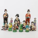 A collection of 13 Chinese and Japanese statues made of porcelain and ceramics. (10 x 11 x 25 cm)