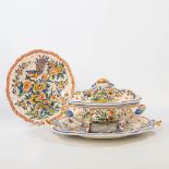 A tureen and plate with rich hand-painted decor. Made of faience in Strasbourgh, France. (34 x 47,5