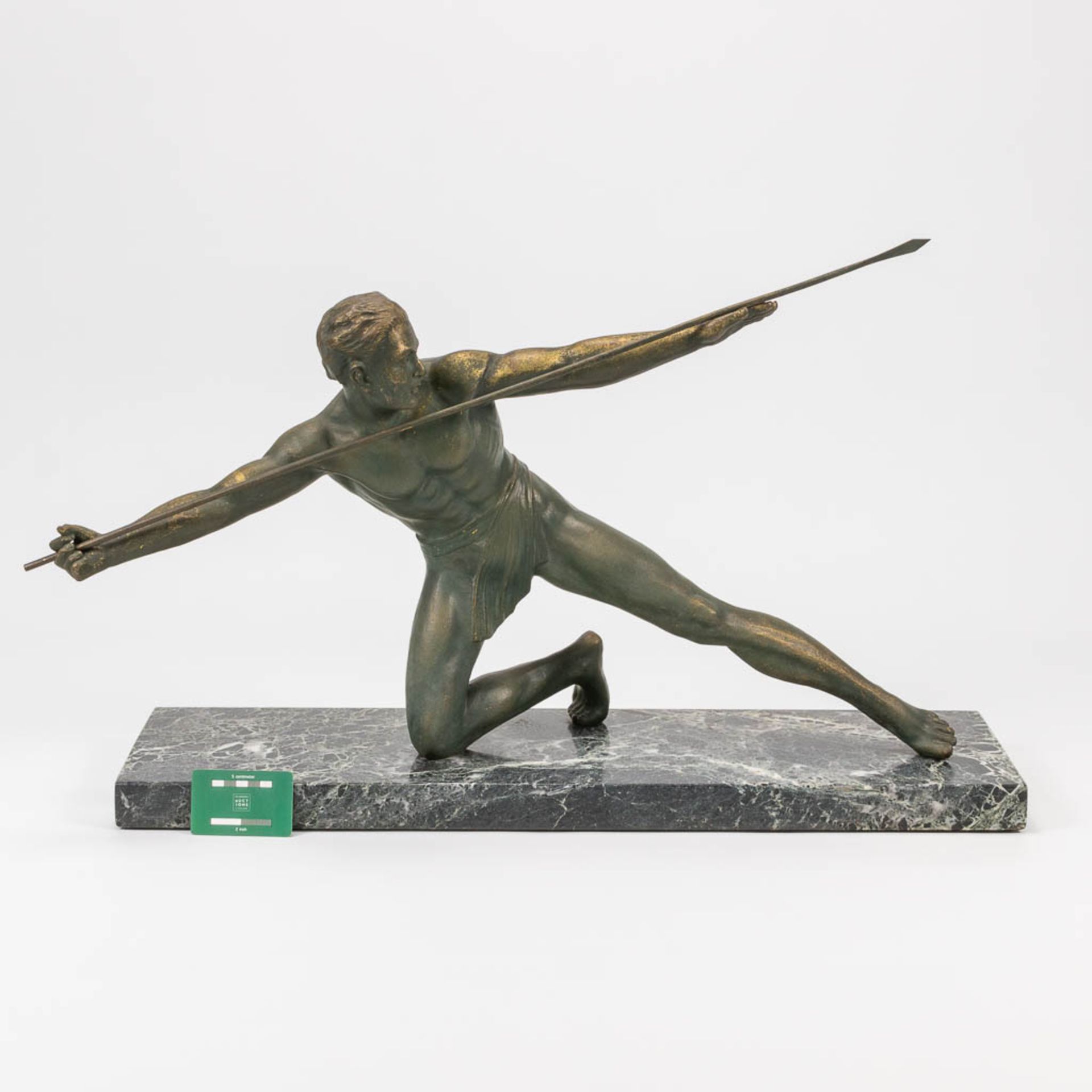 A bronze statue of a spear thrower in art deco style and standing on a marble base. The first half o - Bild 2 aus 13
