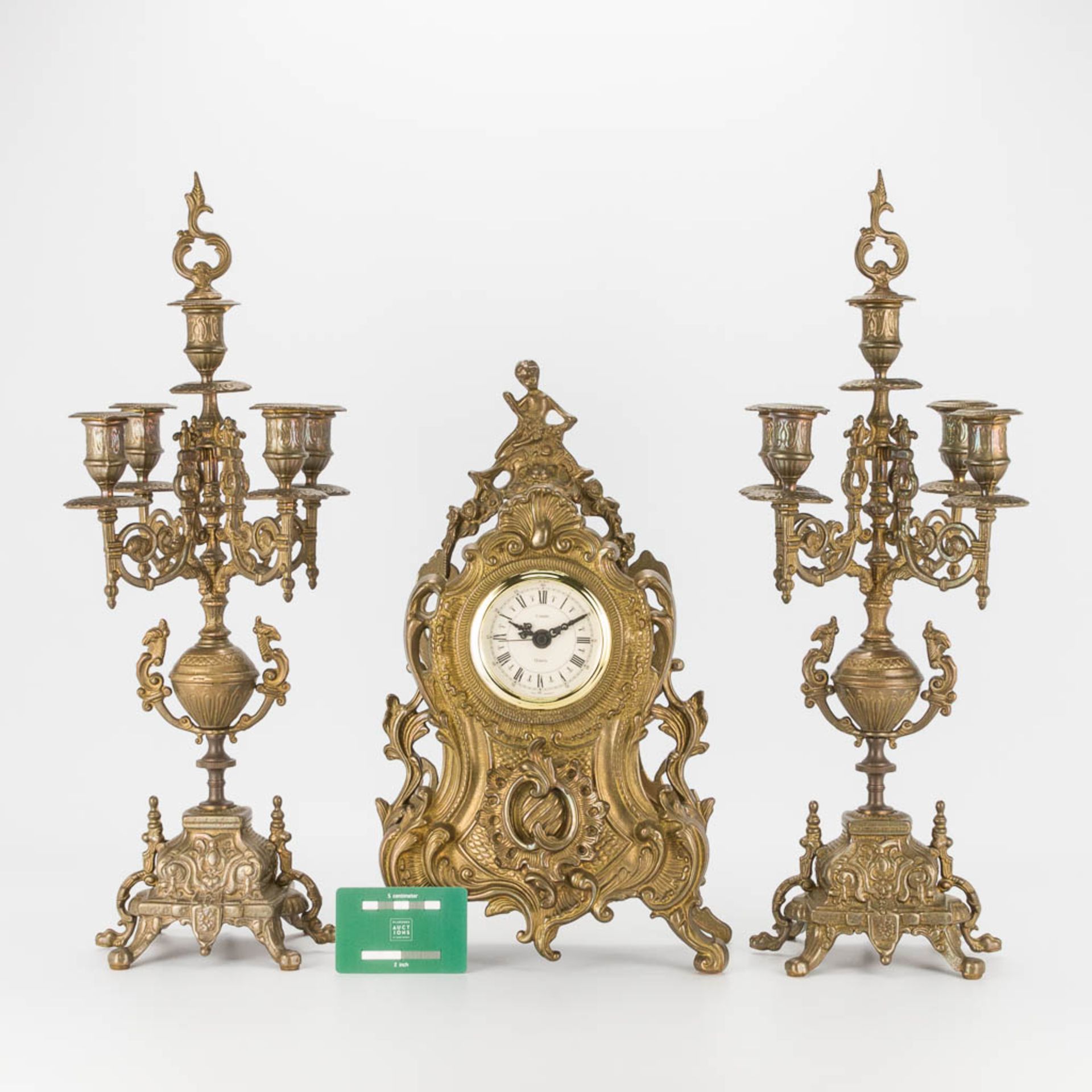 A bronze 3-piece garniture with clock and candelabra. The second half of the 20th century. (22 x 22 - Image 11 of 16