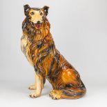 A statue of a Rough Collie made of resine. (30 x 42 x 70 cm)