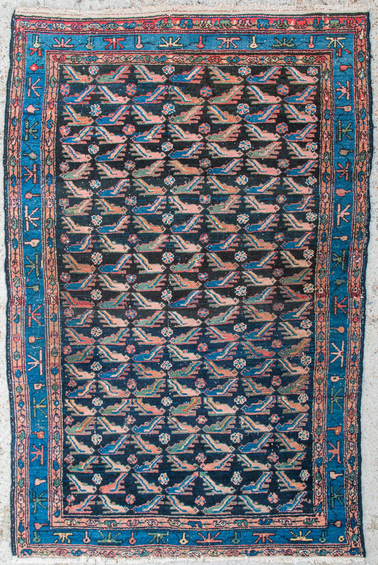 An Oriental hand-made carpet. (120 x 183 cm)