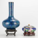 A collection of 2 cloisonne vases standing on a wood base. (38 x 25 cm)