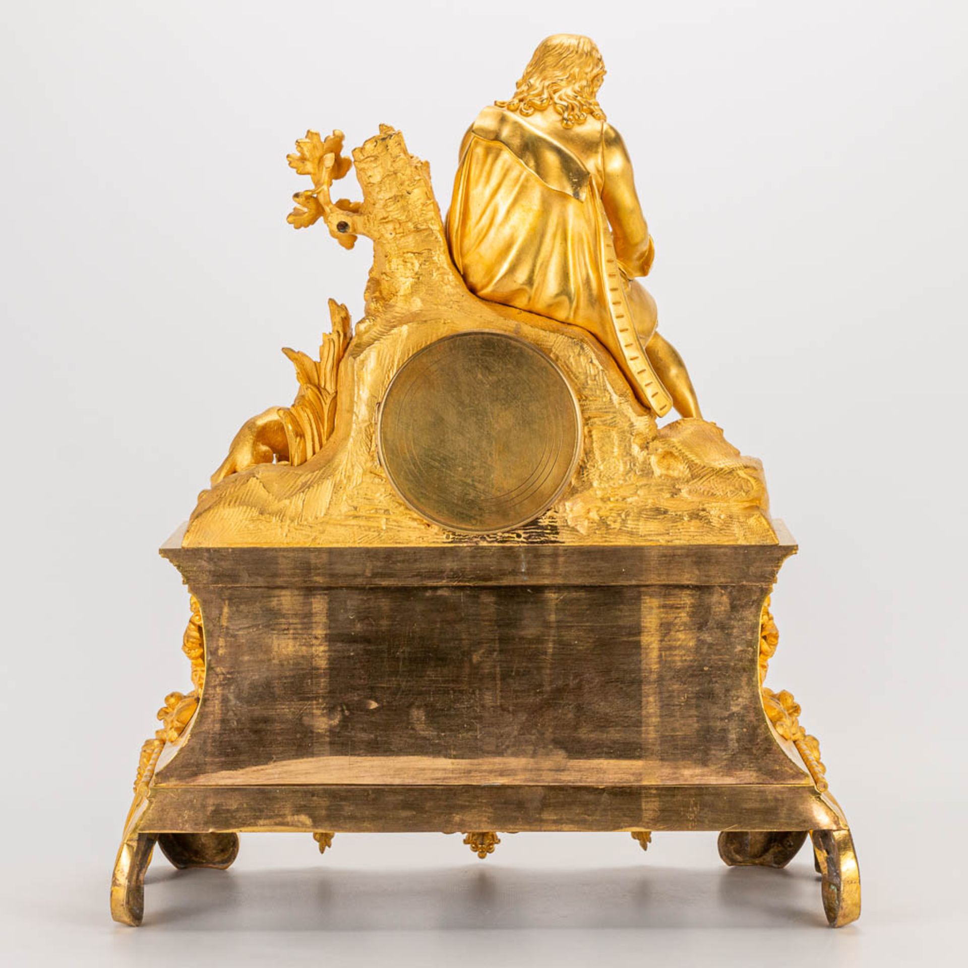 A table clock made of ormolu bronze with a sitting figurine. The second half of the 19th century. (1 - Image 7 of 24