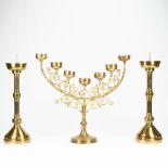 An assembled collection of neogotic candlesticks and a candelabra. The first half of the 20th centur