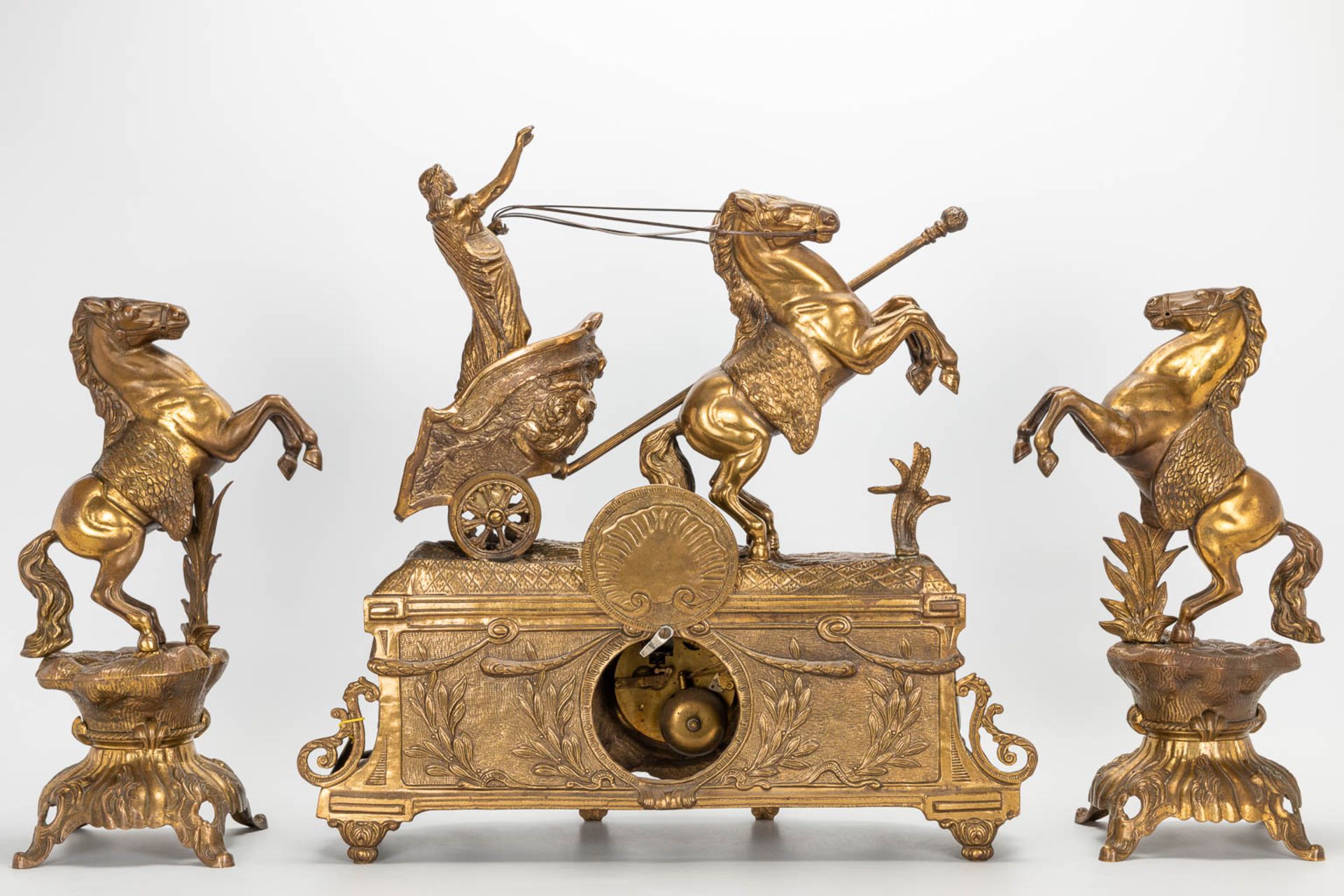 A 3 piece garniture clockset made of bronze, consisting of a clock with battle cart and 2 side piece - Image 13 of 18