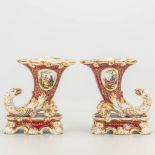 A pair of horn vases, decorated with eagles and hand-painted decor with gold accents. Vieux Bruxelle