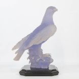 Decorative figurine of an eagle, standing on a wood base. Marked Auglo, made in Spain. (25 x 34 x 51