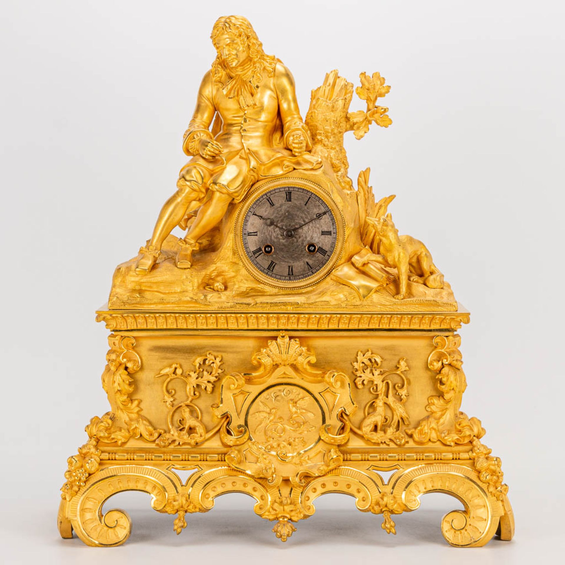 A table clock made of ormolu bronze with a sitting figurine. The second half of the 19th century. (1 - Image 9 of 24