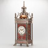 A clock made of metal in neogothic style with 9 bells, 20th century. (23 x 30 x 76 cm)