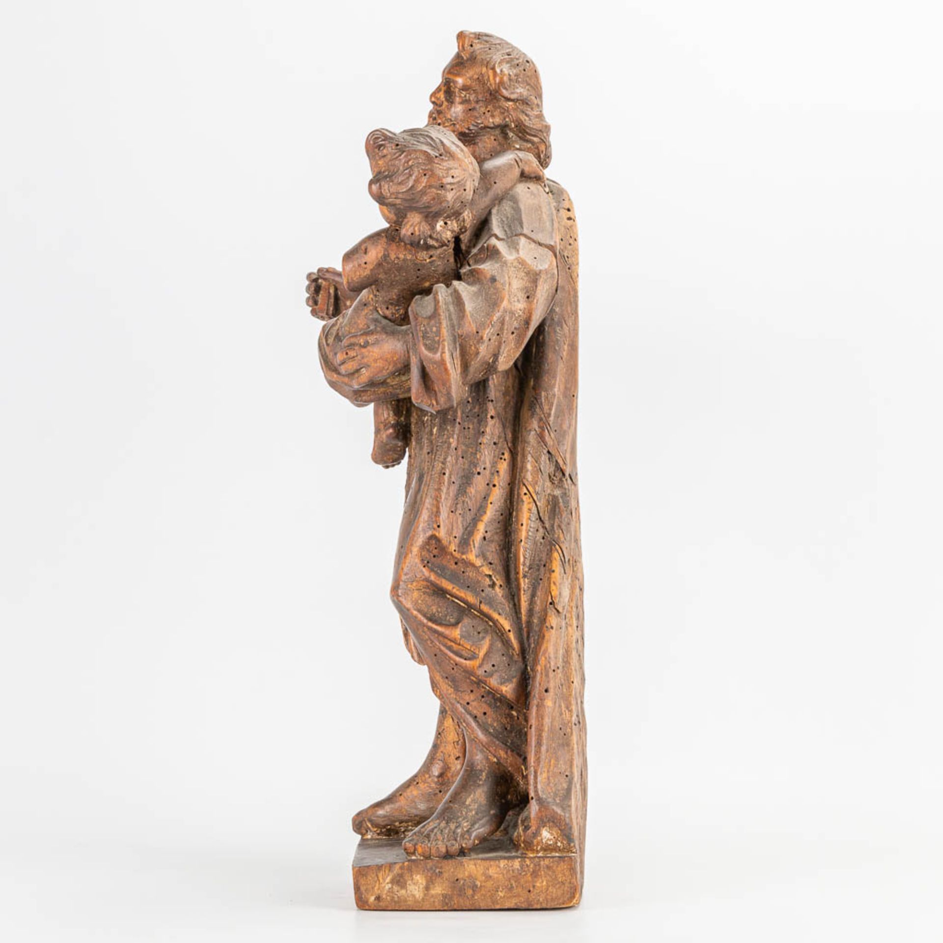 An antique wood sculptured statue of 'Joseph and Child.' 17th/18th century. (14 x 27 x 48 cm) - Image 2 of 11