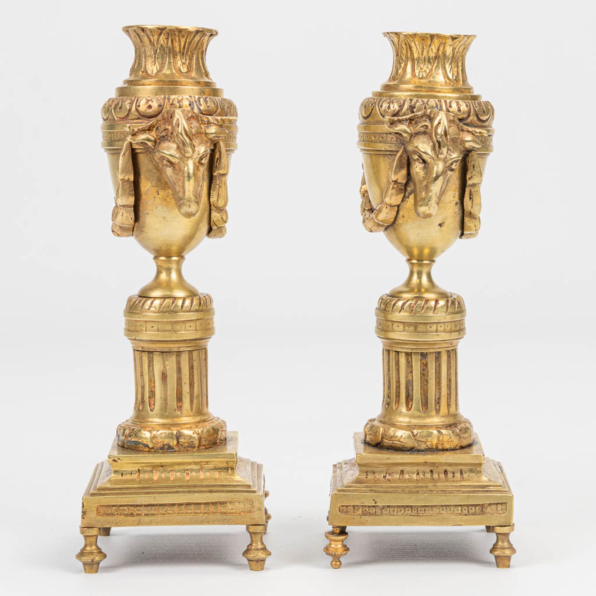 A pair of candlesticks with reversible candle holders and ram's heads in Louis XVI style. (7 x 8 x 1 - Image 3 of 8