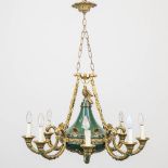 A chandelier in empire style made of bronze with 8 points of light. The first half of the 20th centu