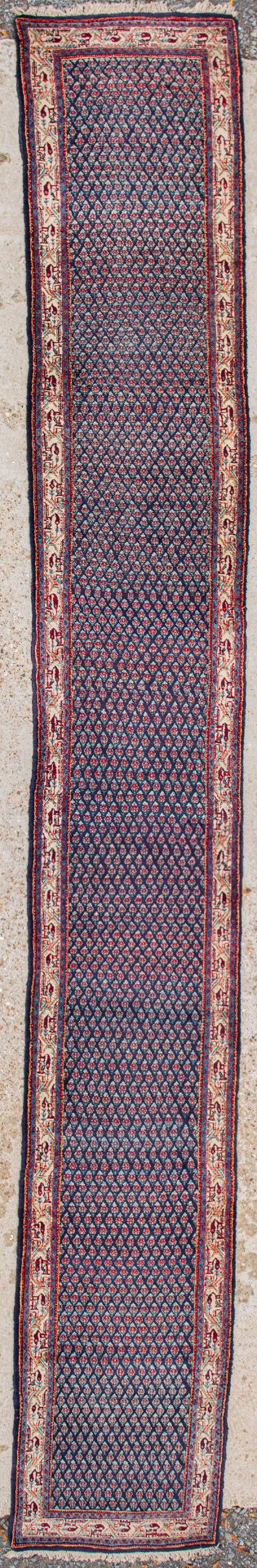 An Oriental hand-made runner carpet. Hamadan. (623 x 80 cm)