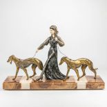 An art deco group of a lady walking her two dogs, spelter and marble. Marked Scali. (16,5 x 78 x 49