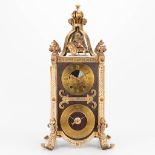 A clock made of metal and marked 'Je sonne la bonne heure'. Neogothic style, 20th century. (22 x 24