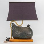 A mid-century figural table lamp with chicken on wood base, made in Florence, Italy. (17 x 30 x 25 c