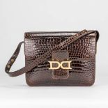 A Delvaux handbag made of crocodile leather and finished with gold-plated elements. (10 x 24 x 19 cm
