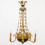 A chandelier in empire style made of bronze with 5 points of light. The first half of the 20th centu