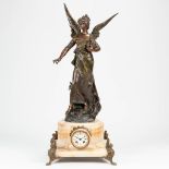 A clock made of alabaster, mounted with spelter angel and fenix. The first half of the 20th century.