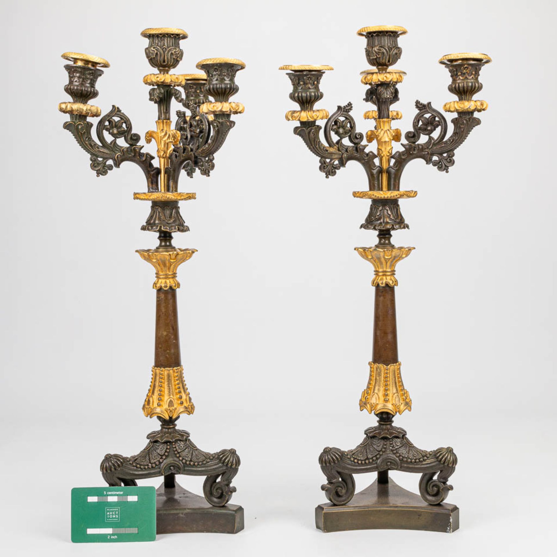 A pair of candelabra with gilt and patinated bronze in empire style, of the period. (16 x 20 x 51 cm - Image 2 of 6