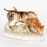A statue of 2 dog figurines, made of porcelain in Bohemia and marked Royal Dux. (14 x 37 x 20 cm)
