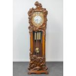 A roccoco standing clock, sculptured wood with westminster movement, the second half of the 20th cen