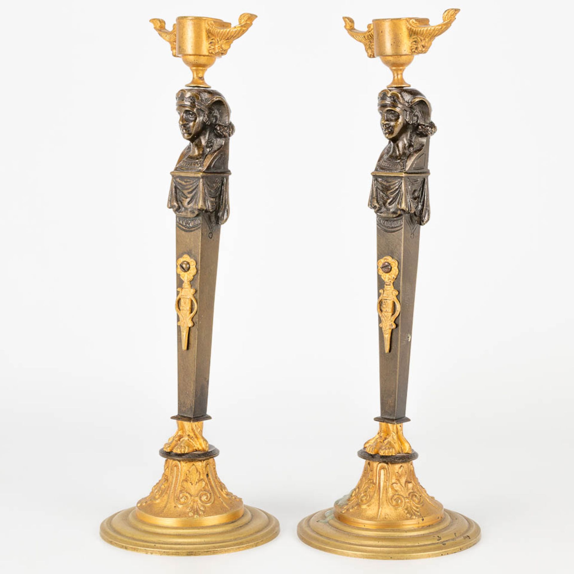 A pair of candlesticks made of gilt and patinated bronze in empire style. (27,5 x 9,5 cm) - Image 6 of 15