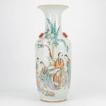 A Chinese vase with decor of ladies and playing children. 19th/20th century. (57,5 x 21 cm)