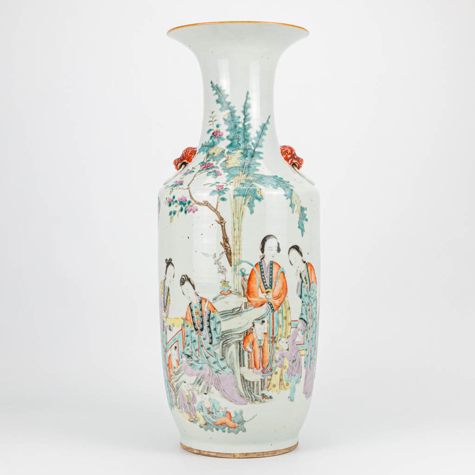 A Chinese vase with decor of ladies and playing children. 19th/20th century. (57,5 x 21 cm)